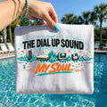 May include: White canvas pouch with the text "Lived in The Dial Up Sound My Soul" in black, teal, and orange. The design includes illustrations of a landline phone, modem, computer, floppy disk, and a dial-up sound wave.