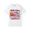 May include: White t-shirt with a colorful graphic design featuring a jack-o'-lantern, shopping bags, and a cell phone. The text on the shirt reads "Trick or Treat" and "Then Limited Too". The design includes hearts, stars, and butterflies.